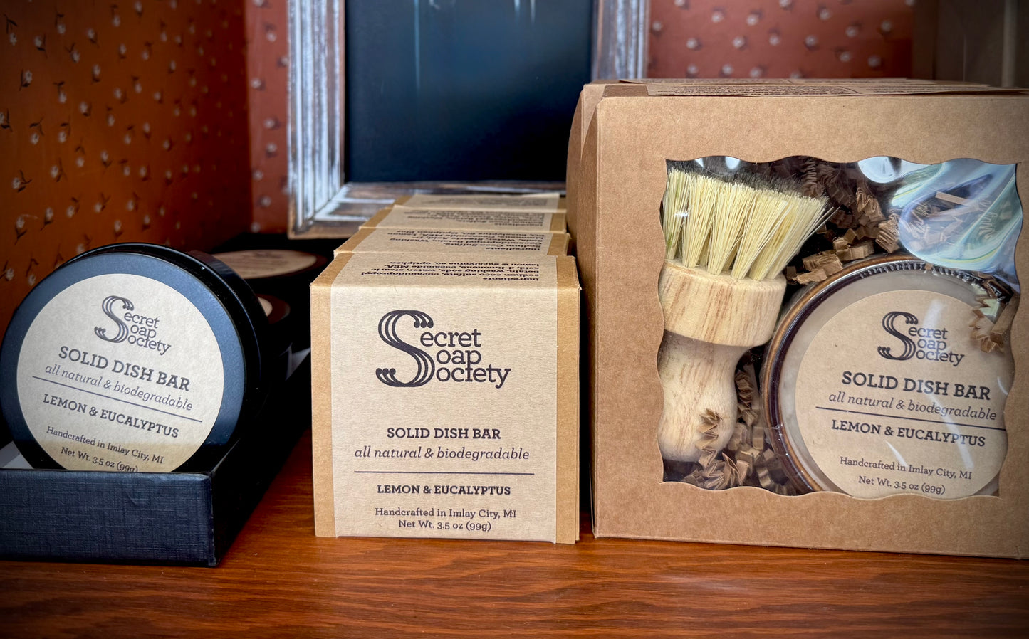 Solid dish bars from The Secret Soap Society on a wooden surface